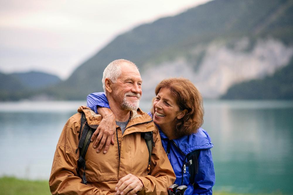 Couple pose for a photo after dental treatment at Pradera Dental