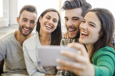 Friends taking a selfie after teeth whitening at Pradera Dental