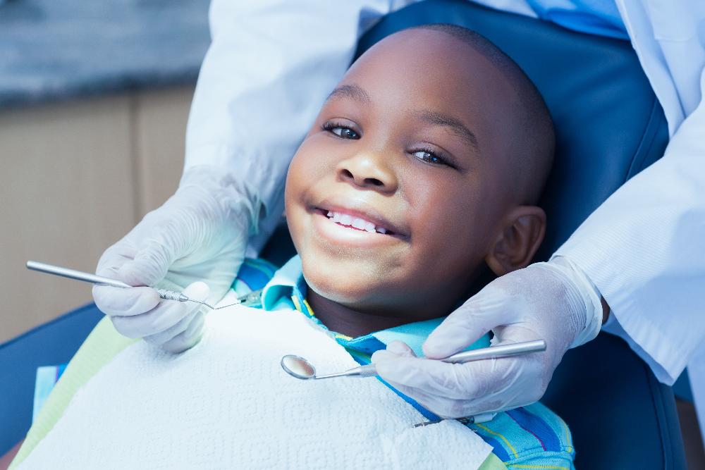 A kid undergoing teeth cleanings and Examination in Sterling, CO
