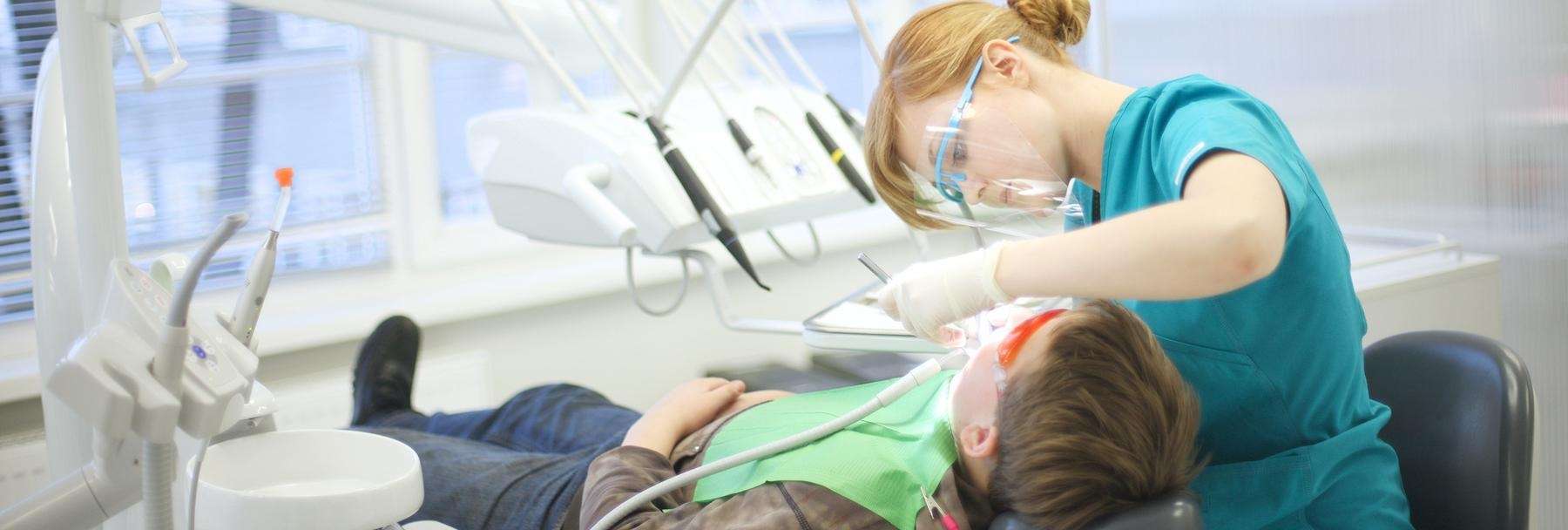 A patient undergoing dental extraction at Pradera dental in Sterling, CO.